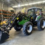 Front angled shot of the AK1304C 130HP tractor in an industrial shed setting
