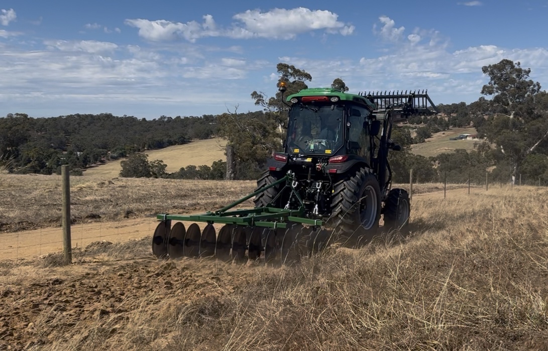 Agking tractor making firebreaker