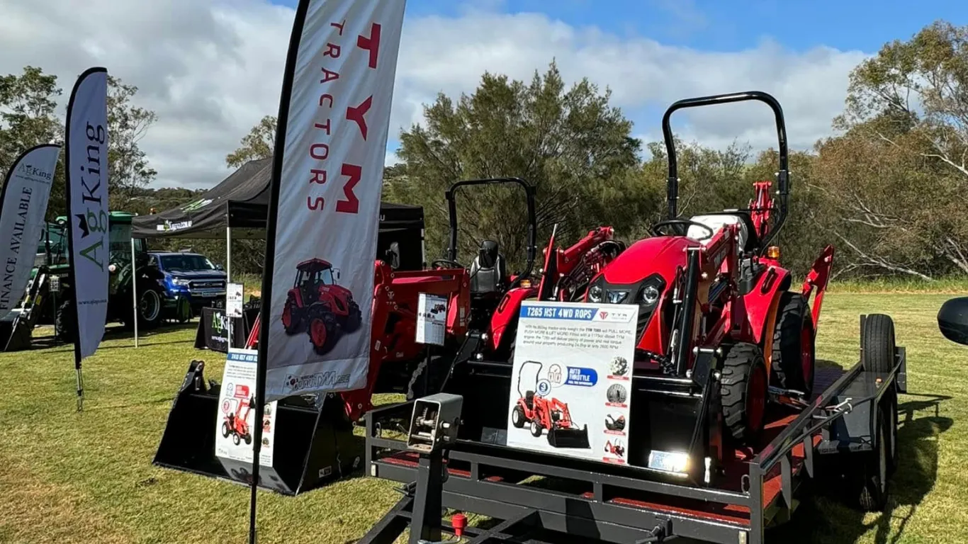 TYM tractor AgKing May 2026 TYM tractor display at a West Australian outdoor agricultural field day with branded signage