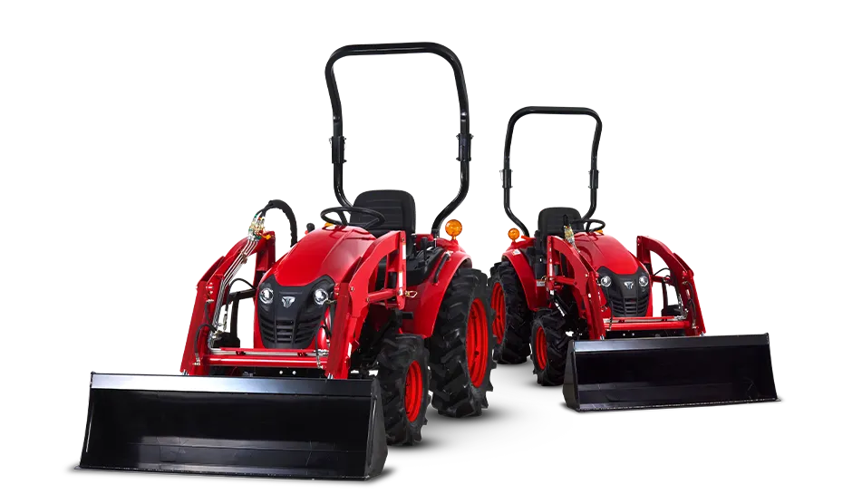 Two red TYM compact tractors fitted with front-end loader buckets and ROPS frames, shown side by side