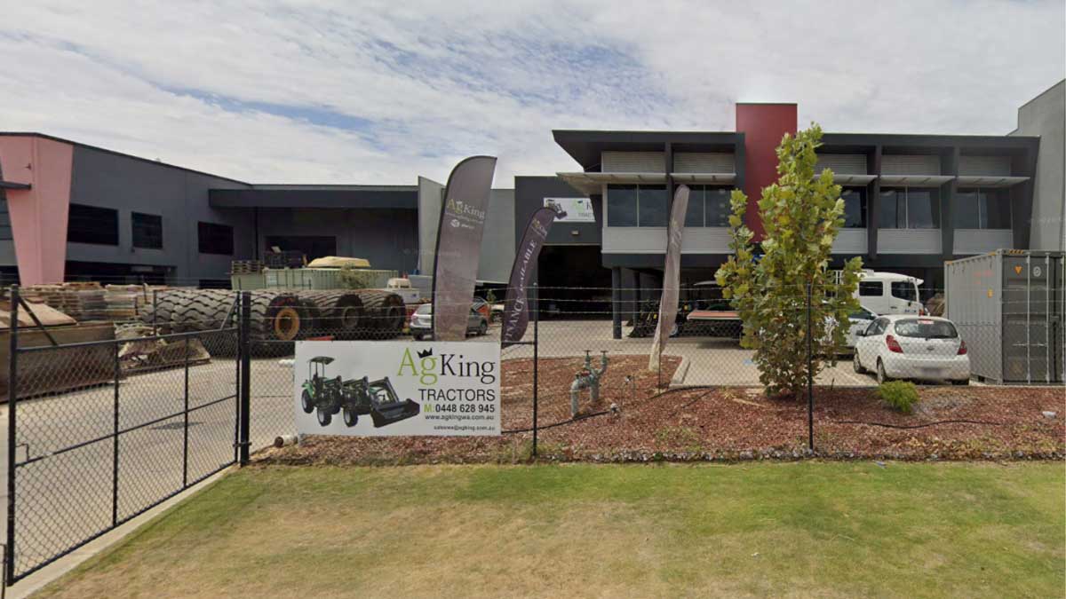 New to tractors and ready to buy AgKing Tractors dealership storefront with signage and tractor stock visible in the yard.