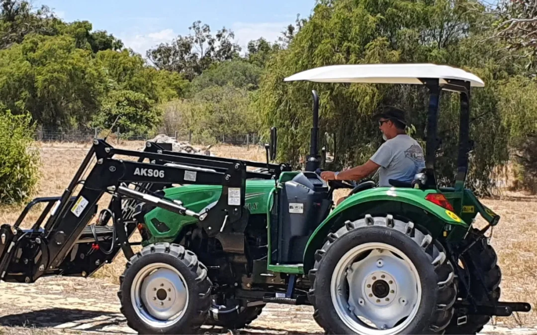 Tractor with rollover protection operating in a paddock in Western Australia