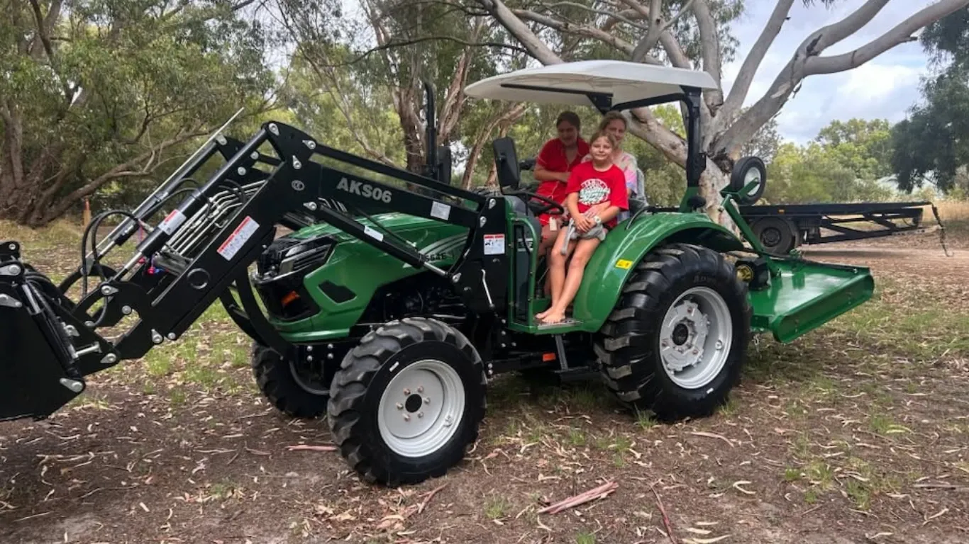 Farming family with children on a tractor with ROPS fitted